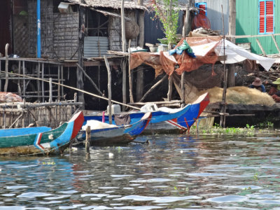 Houses (on stilts/piles) and boats in a stilted village on Tonle Sap Lake in the Siem Reap Province of Cambodia