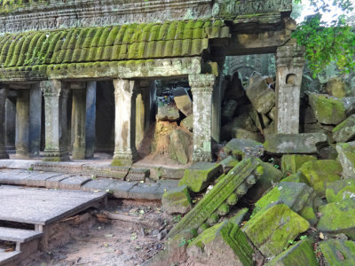 Ta Prohm Temple - exterior overrun by moss - in Angkor, Siem Reap Province, Cambodia