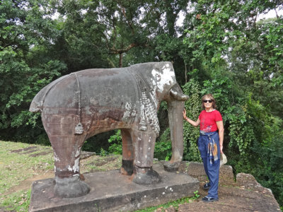 Judy next to a statue of an elephant at the East Mebon Temple - Angkor, Siem Reap Province, Cambodia