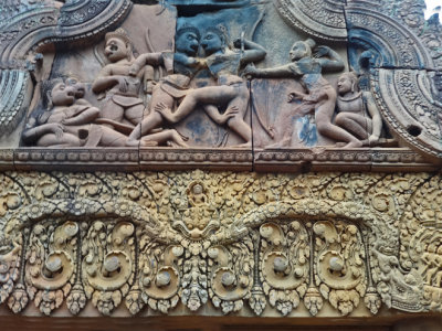 Bas reliefs: Upper: Combat between Vali and Sugriva. Lower: Finely detailed carving of an unidentified Hindu god -  Banteay Srei