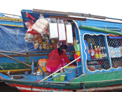 A floating store. This vendor went from floating house to floating house to sell her goods - Tonle Sap Lake - Siem Reap Province