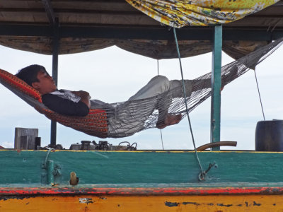 Close-up of the guy taking a nap seen in the previous photo  - Tonle Sap Lake Lake, Siem Reap Province, Cambodia