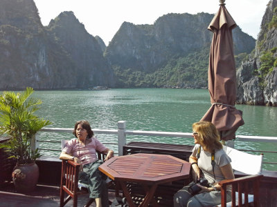 Judy and Fran relaxing  aboard the Treasure Junk in Ha Long Bay, Vietnam