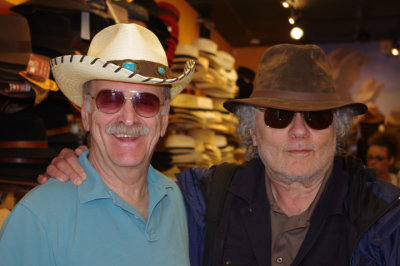 Ken and Richard (both looking svelte?) - trying on hats in a hat store in the French Quarter of New Orleans