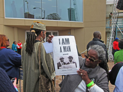 I Am A Man poster held by a spectator at the reopening ceremony of the National Civil Rights Museum at the Lorraine Motel