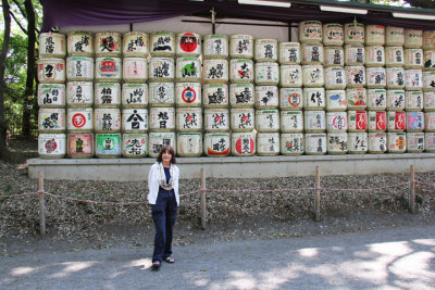 Judy in front of the sake barrels (kazaridaru) on the gravel road entrance to the Meiji Shrine - Tokyo