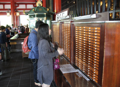 Pay 100 yen here for a fortune - next to the Main Hall of the Senso-ji Temple - Tokyo