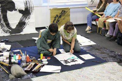 Judy creating a calligraphy painting with the help of Masunaga Koshun - Judy chose a butterfly theme for the painting