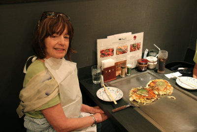 Judy at lunch - a Modanyaki pancake with noodles - Tokyo