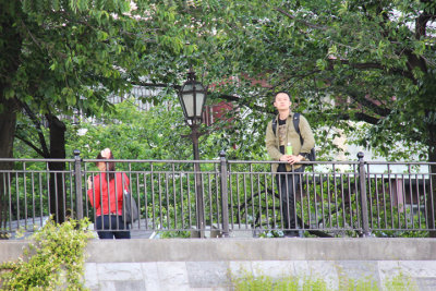 A young man and a young woman next to the Sumida River as seen from our water bus, Tokyo