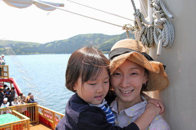 Mother and child aboard a cartoonish pirate ship on Lake Ashi going from Moto-Hakone to Togendai.