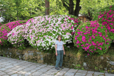 Judy near azaleas at the entrance to Kenroku-en Garden in Kanazawa