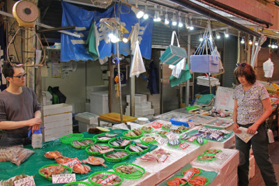 Judy at a fresh fish stall at the indoor Omi-cho Market in Kanazawa
