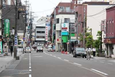 The large green awning on the right side of the street marks the entrance to the indoor Omi-cho Market in Kanazawa