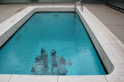 Judy (far right) appears to be waving under water in the Swimming Pool by Leandro Erlich - at the Contemporary Art Museum