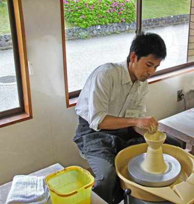 An artist creating a bowl at the Nomi Kutani Ceramics Center in the Kutani Pottery Village in Nomi-shi