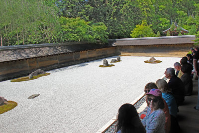 Judy after meditating (yoga?) at the Kare-sansui (Dry Landscape) Rock Garden or “Zen Garden” at the Ryoanji Temple