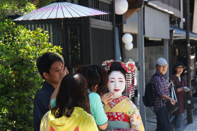 This woman appears to be a Maiko (apprentice Geiko) but may have been a tourist - in the Gion (Geisha/Geiko) District of Kyoto