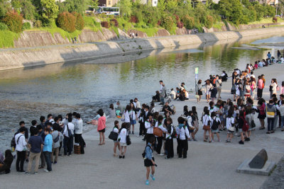 Young people at the Kamo River - early Friday evening - a few blocks from the center of downtown Kyoto
