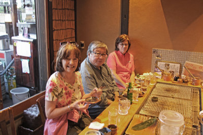 Judy, Sharon and John having dinner in a restaurant on Pontocho Alley near the Kamo River in Kyoto