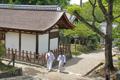 Two monks in the Kasuga Taisha complex (a Shinto shrine)  in Nara Park in Nara