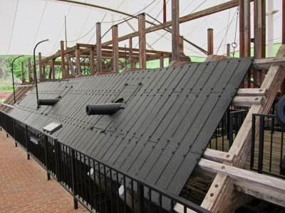 Framework for paddlewheels (background), cannons and steel plates of the Union's U.S.S. Cairo gunship in the U.S.S. Cairo Museum