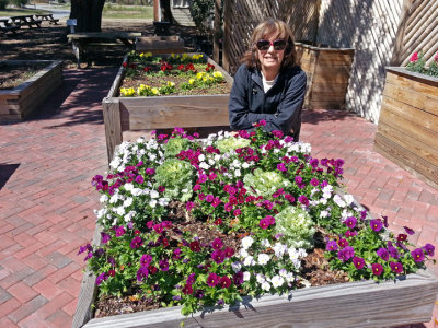 Judy near flower boxes at the Coastal Georgia Botanical Gardens - Savannah