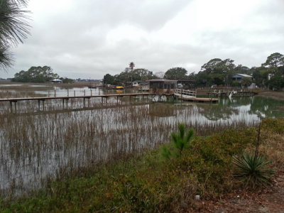 House and dock on a large salt water marsh - approaching the beach area on Tybee Island