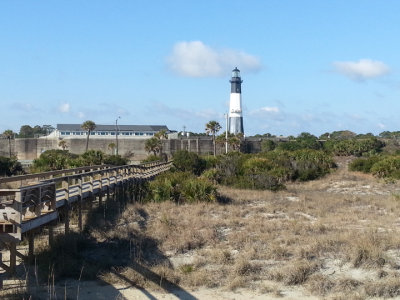 The Tybee Lighthouse and a walkway to the beach on the North Coast of Tybee Island 