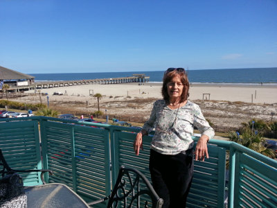 Judy on our patio overlooking the beach and the ocean - East Coast of Tybee Island