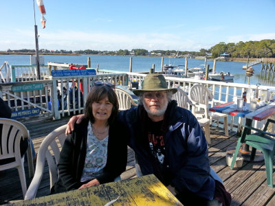 Judy and Richard in the open area of A-J's Dockside Restaurant overlooking the Savannah River (its Back River) - Tybee Island