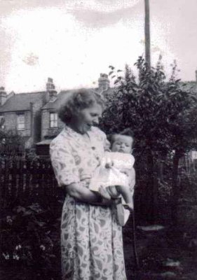 The only surviving photo of me as a baby held in my mothers arms in 1950