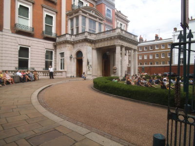 People relaxing in grounds of Wallace Collection, Manchester Square