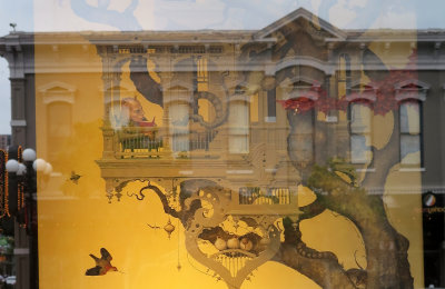A Painting in an Art Gallery Window with Street Building Reflection