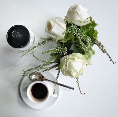 Black coffee and white roses