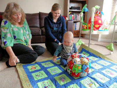 Harry with his puff quilted ball and alphabet quilt