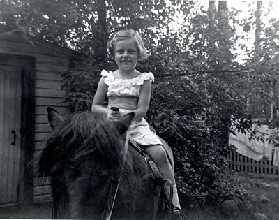Riding a pony at the cottage, 5 years old