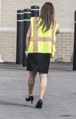 Lady with safety vest and bollards 1