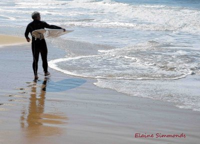 This surfer was about to enter the water when I captures this shot of him as the sun was coming up.
