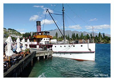 The Steamer Earnslaw at Queenstown on a mountain lake in New Zealand.
The boat was built in Dunedin over 100 years ago and was brought to the Lake
in sections, where it was assembled. 
One of its main functions was and is to supply Sheep Farmers on the mountain side of the lake, 
where there are few road links to any towns.

The Earnslaw is also very popular with tourists
and there is a most interesting historical museum on board of the early years 
on the lake and showing photos and relics of early paddle steamers
that were used in the 1800's.  

The mountains in the background are called The Remarkables 
and in Winter are very popular with skiers.
Ski lifts operate all year round for sight-seers.
