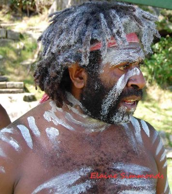 This photograph is of my friend, Reuben Doolah, a famous indigenous performer.
Reuben Is of Torres Strait and Aboriginal origins.
He is painted in traditional ochre for a performance on Clarke Island in Sydney Harbour.
I had taken many photographs that day but had trouble as it was full sun and in the middle of the day. I recropped it after uploading the previous pic.  