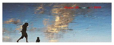 This was photograph taken on the beach
at low tide.
There were wonderful reflections of clouds 
in the water left on the sand.
