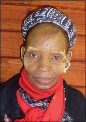 This Zulu Lady works on the farm for a friend of
mine in Greytown Natal South Africa.
Note the mud she applies to her face to prevent sunburn.
