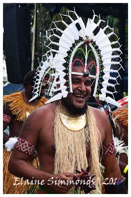 Torres Strait dancer shows his pleasure
after a successful performance in Cairns,
Queensland.
His dhuri,or head dress,is representative
of a shark with an open mouth.