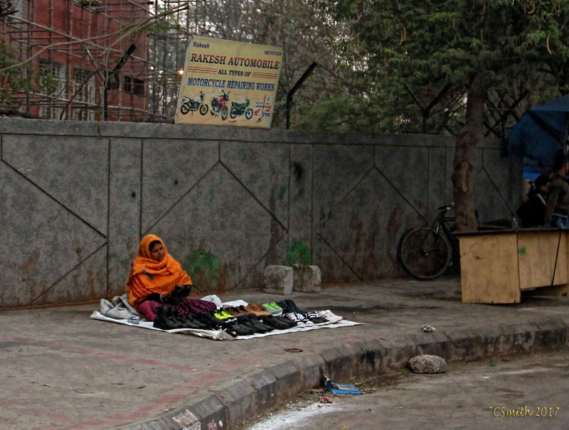LADY SELLING SHOES ON THE STREET