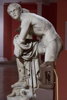 Hermes tying his sandal