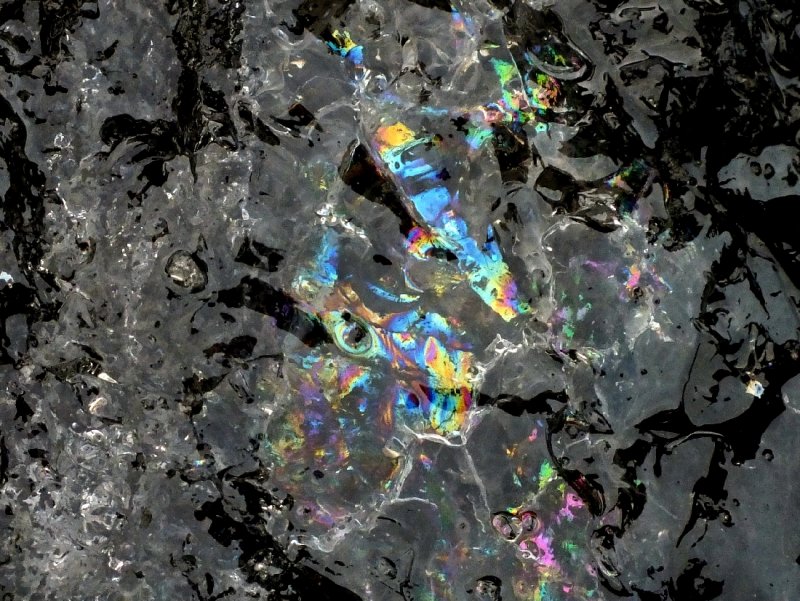 Various colors reflecting from inside the piece of ice