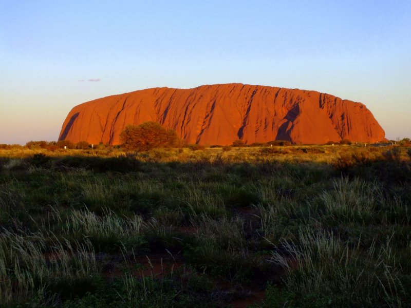 A sequence of pictures as the sun sets on Uluru