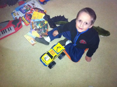Max giving his worm a ride in the truck