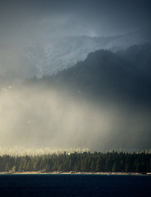 Rain falling on Incline Village Beach & Treeline - Snow Above